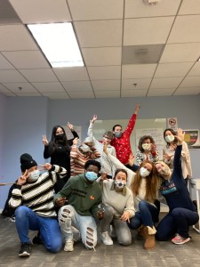 Photo of a mixed group of students at the Washington English Center posing for the camera