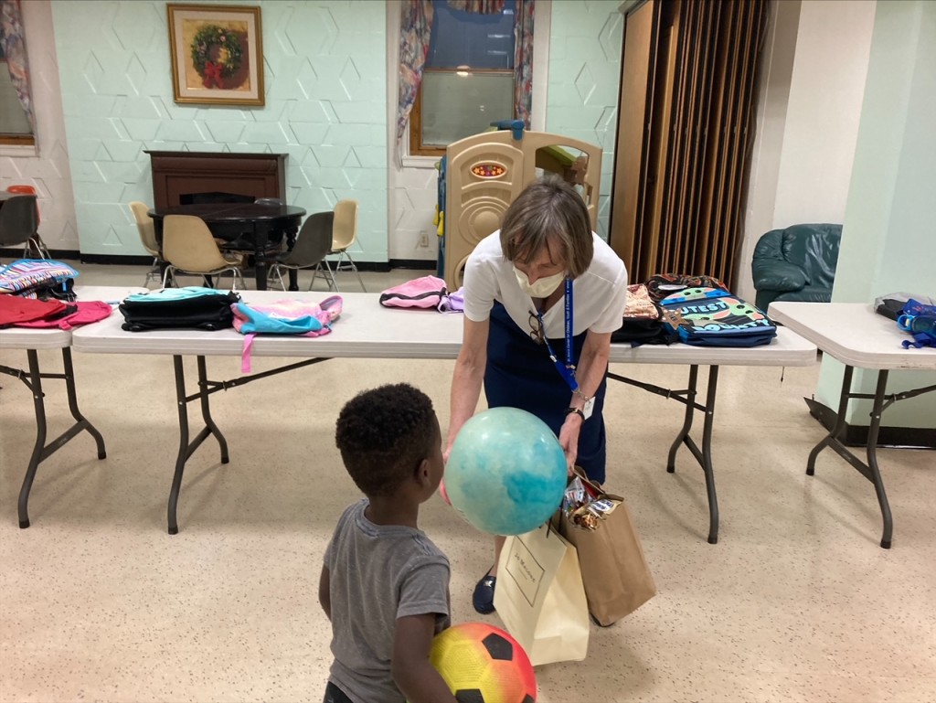 Sister Mary in St. Ann?s Center?s auditorium with a young resident during their recent back-to-school supply drive for St. Ann?s Families